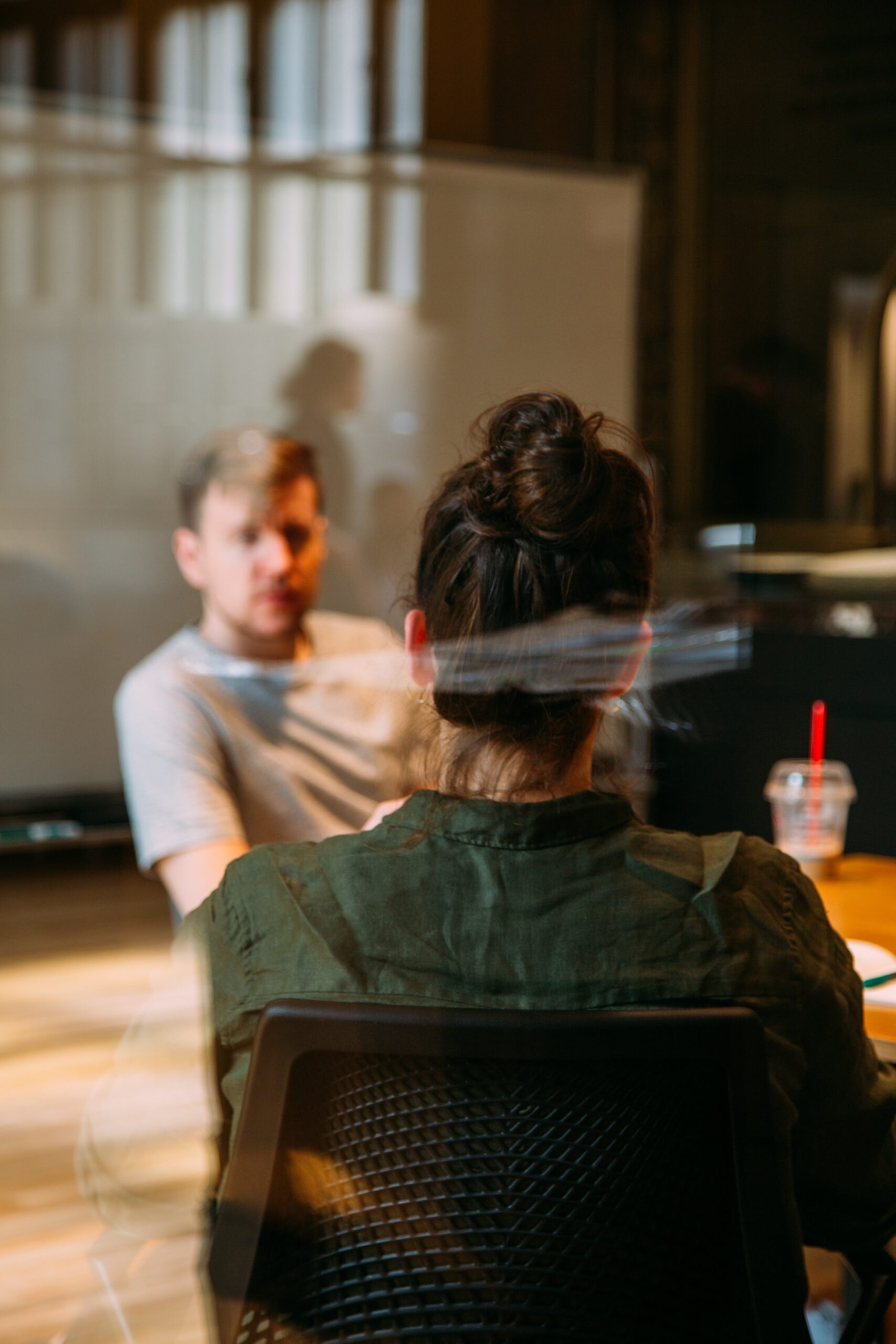 two people are consult in meeting